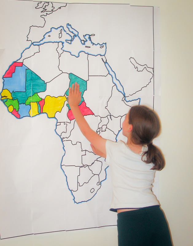 Finding countries of Africa on a large wall map of Africa.